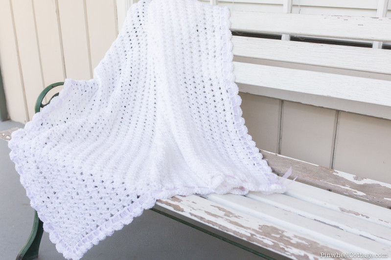 White Crochet Baby Afghan with a Purple Ribbon
