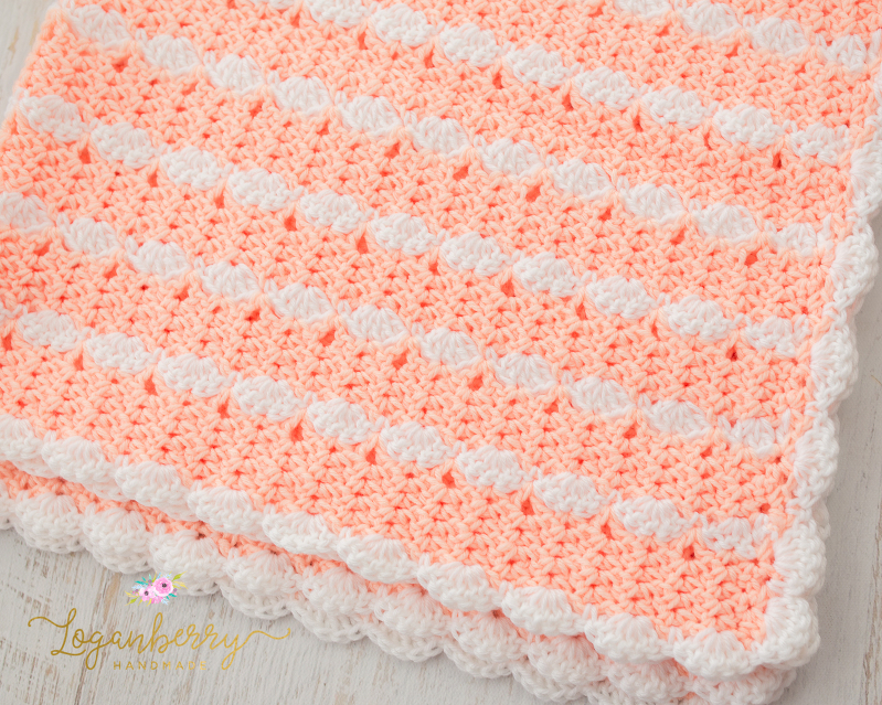 cats and blankets, cat on a blanket, peaches and cream crochet baby blanket, baby blanket crochet pattern, crochet baby blanket tutorial, free crochet pattern, how to crochet a baby blanket, crochet blanket with scallop trim, scallop edge crochet blanket, peach blanket, pink and white blanket