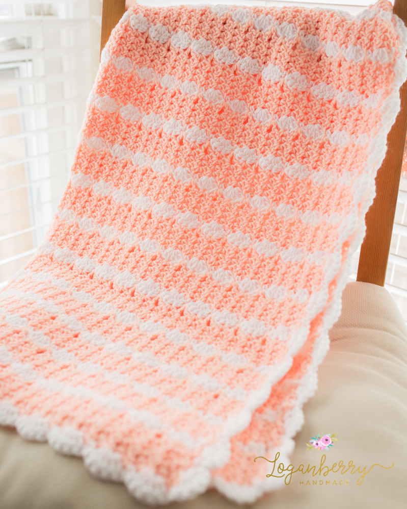 peaches and cream crochet baby blanket, baby blanket crochet pattern, crochet baby blanket tutorial, free crochet pattern, how to crochet a baby blanket, crochet blanket with scallop trim, scallop edge crochet blanket, peach blanket, pink and white blanket