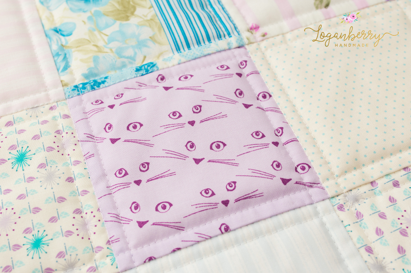 cat eyes and whiskers fabric, cat fabric, purple cats, cats and quilts, charm square patchwork, purple fabric and cats